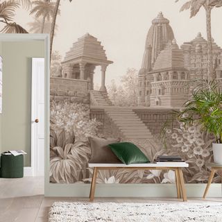 Graham and Brown temple wall mural in a living room with houseplants and bench
