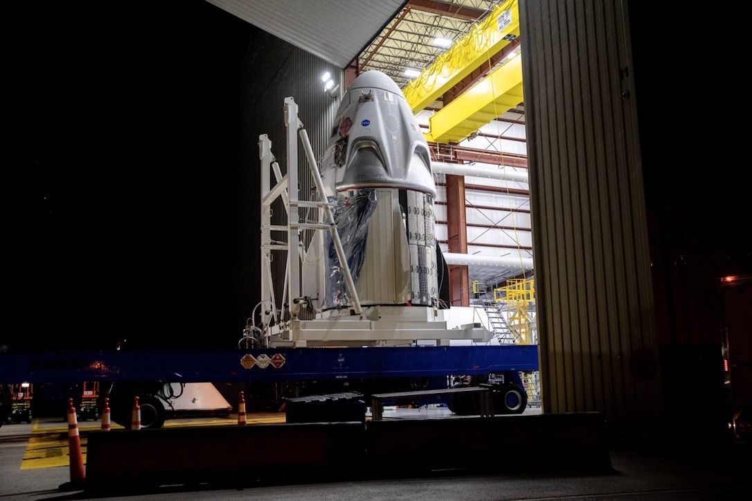 A SpaceX Crew Dragon spacecraft arrives at Launch Complex 39A at NASA’s Kennedy Space Center in Florida, transported from the company’s processing facility at Cape Canaveral Air Force Station on Friday, May 15, 2020, in preparation for the Demo-2 flight test.