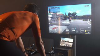 Rider using the BKOOL indoor cycling simulator