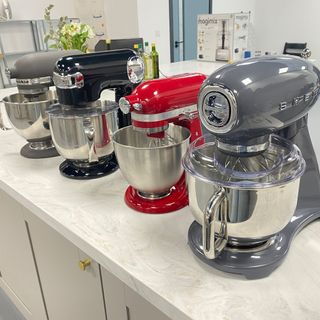Image of four of the best stand mixers on a countertop during our testing process in Reading
