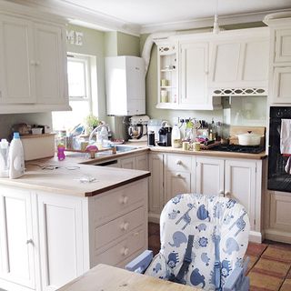 kitchen with white cabinet and white chair