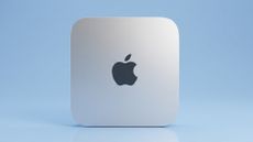 Apple Mac mini on a blue background
