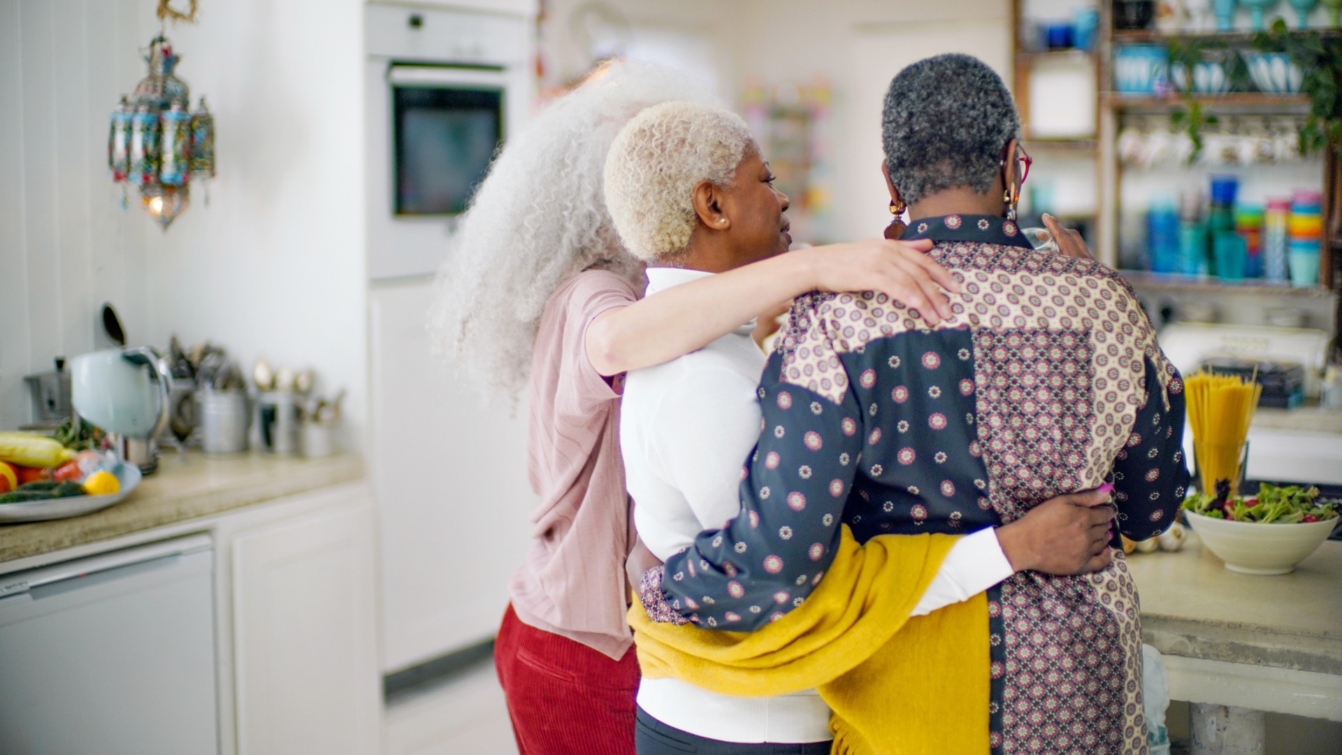 Three sisters hugging