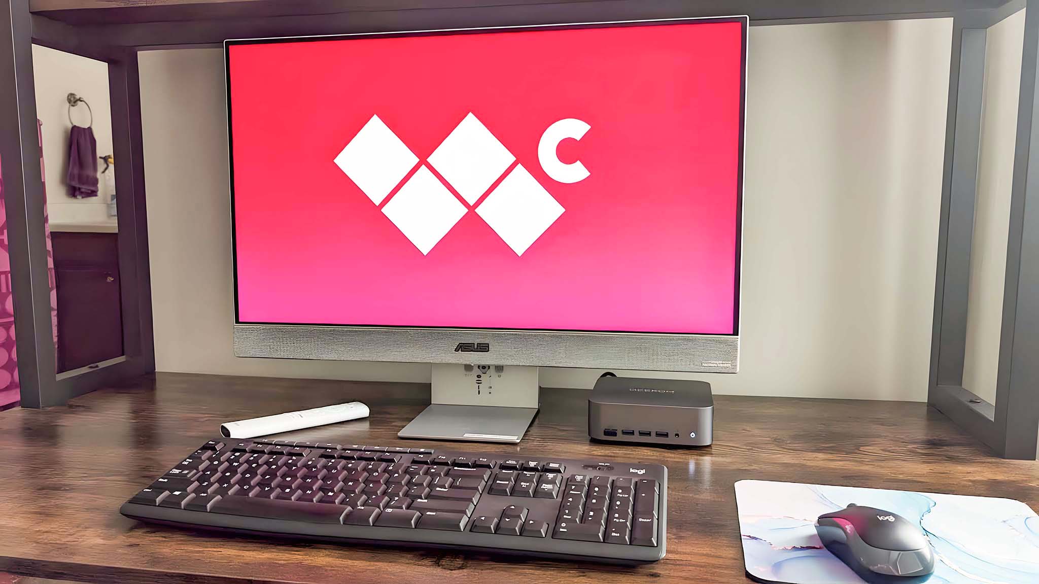 ASUS ZenScreen Smart TV MS27UC on a desk displaying the Windows Central logo.