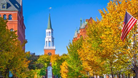 October 18, 2024 - Burlington, Vermont: Autumn view with fall colors looking toward the northern end of Church Street Marketplace toward the church of the First Unitarian Universalist Society of Burlington, Vermont, USA.