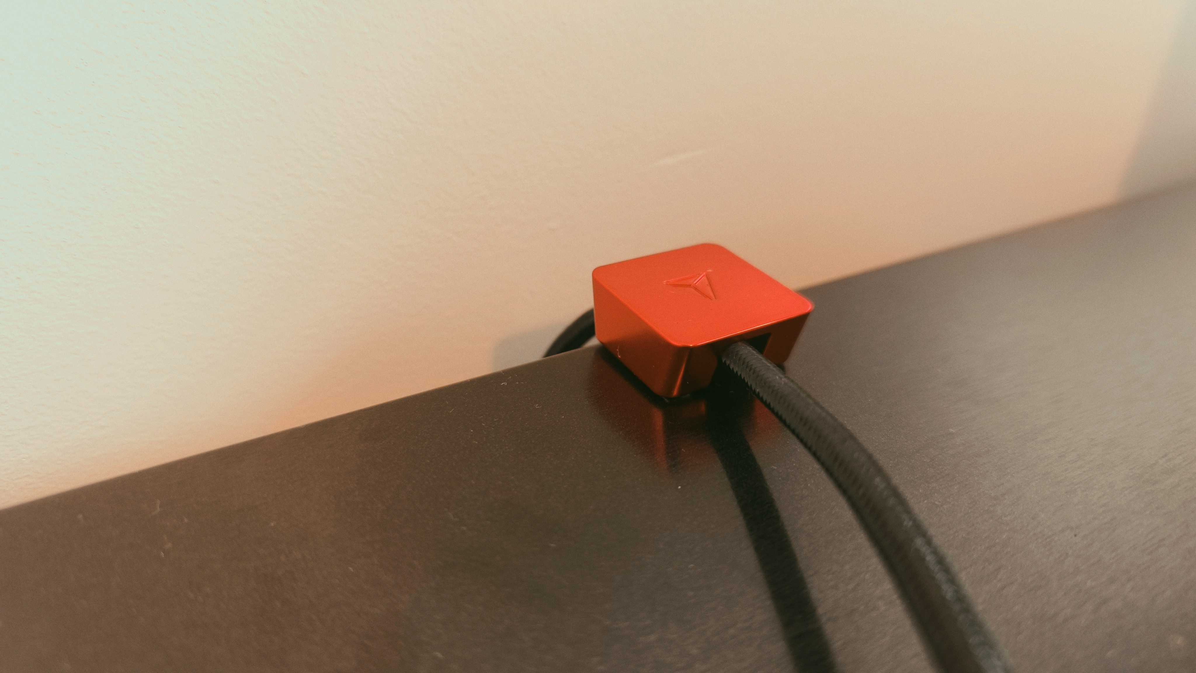 A black Secretlab Magnus Evo desk