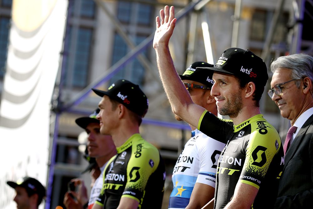 Mitchelton-Scott wave to the crowds on stage at the Tour de France presentation in Brussels
