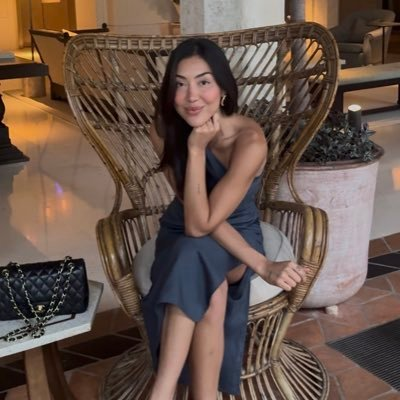 woman sat in wicker chair