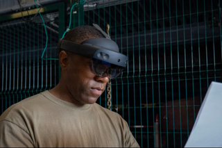 A service member participates in a joint cargo inspection using the HoloLens augmented reality headset in Vicenza, Italy, Aug. 26, 2025.