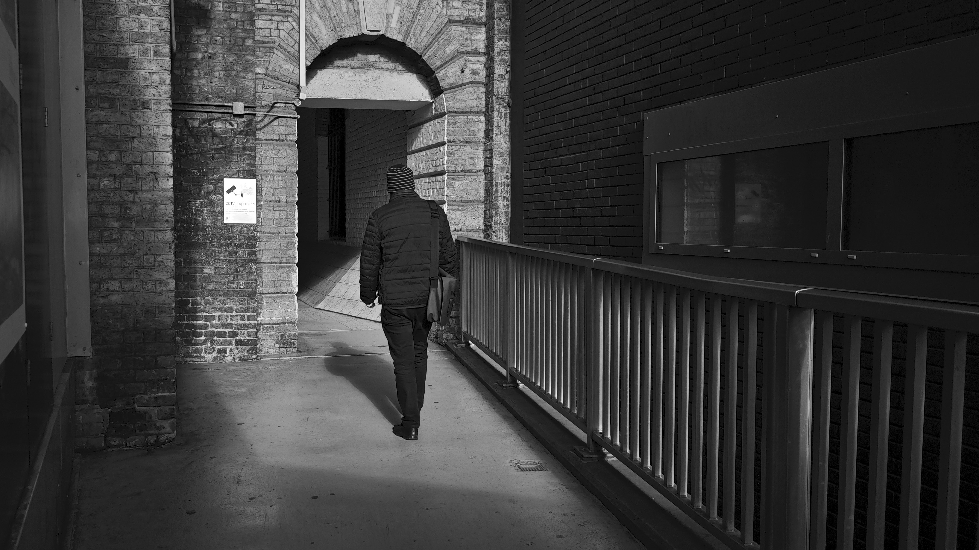 Xiaomi 15 Ultra sample photos; black and white of person walking into tunnel