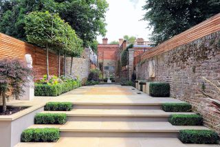 traditional paved garden enclosed by brick walls