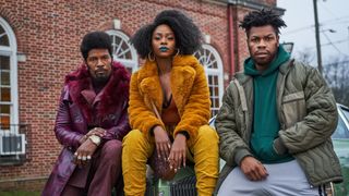 L to R) Jamie Foxx (Producer) as Slick Charles, Teyonah Parris as Yo-Yo and John Boyega as Fontaine sitting on a car on the set of They Cloned Tyrone.