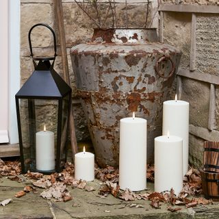 selection of candles and lantern outside front door
