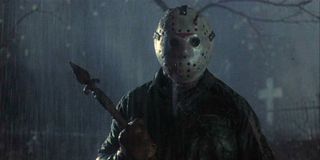 Jason Voorhies stands in the rain holding a weapon in 'Friday the 13th'