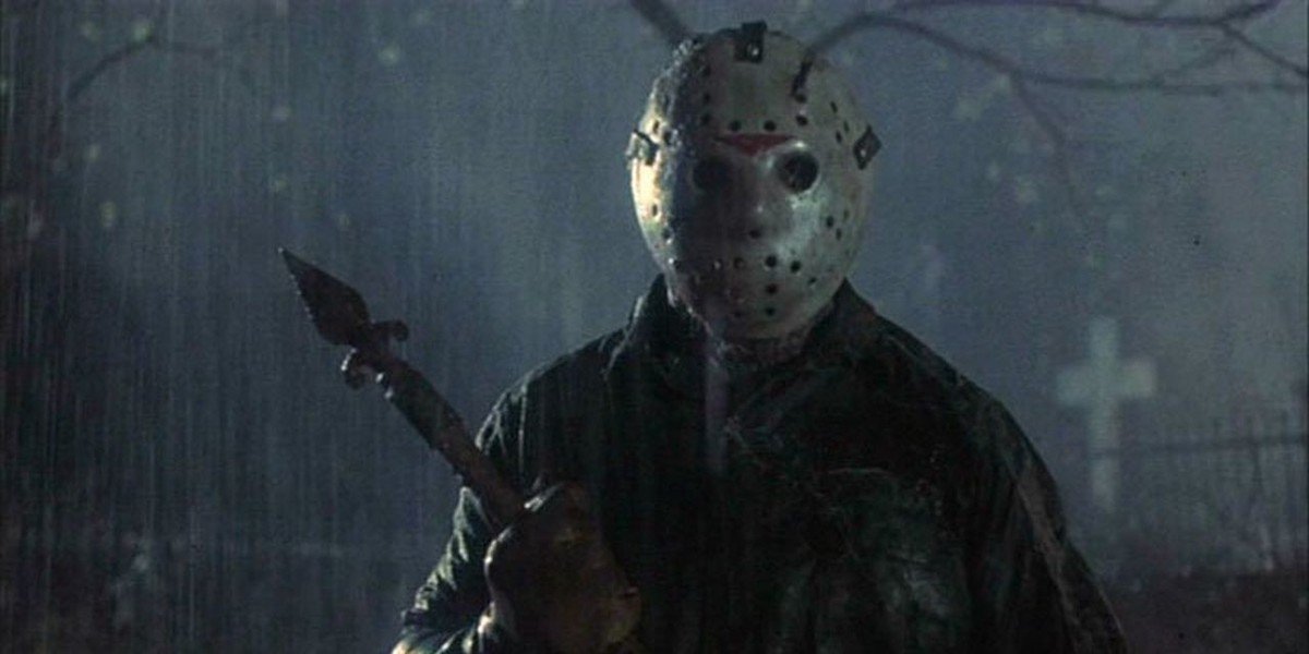 Jason Voorhies stands in the rain holding a weapon in &#039;Friday the 13th&#039;