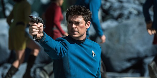 Karl Urban&#039;s Doctor Bones McCoy firing a phaser in Star Trek Beyond