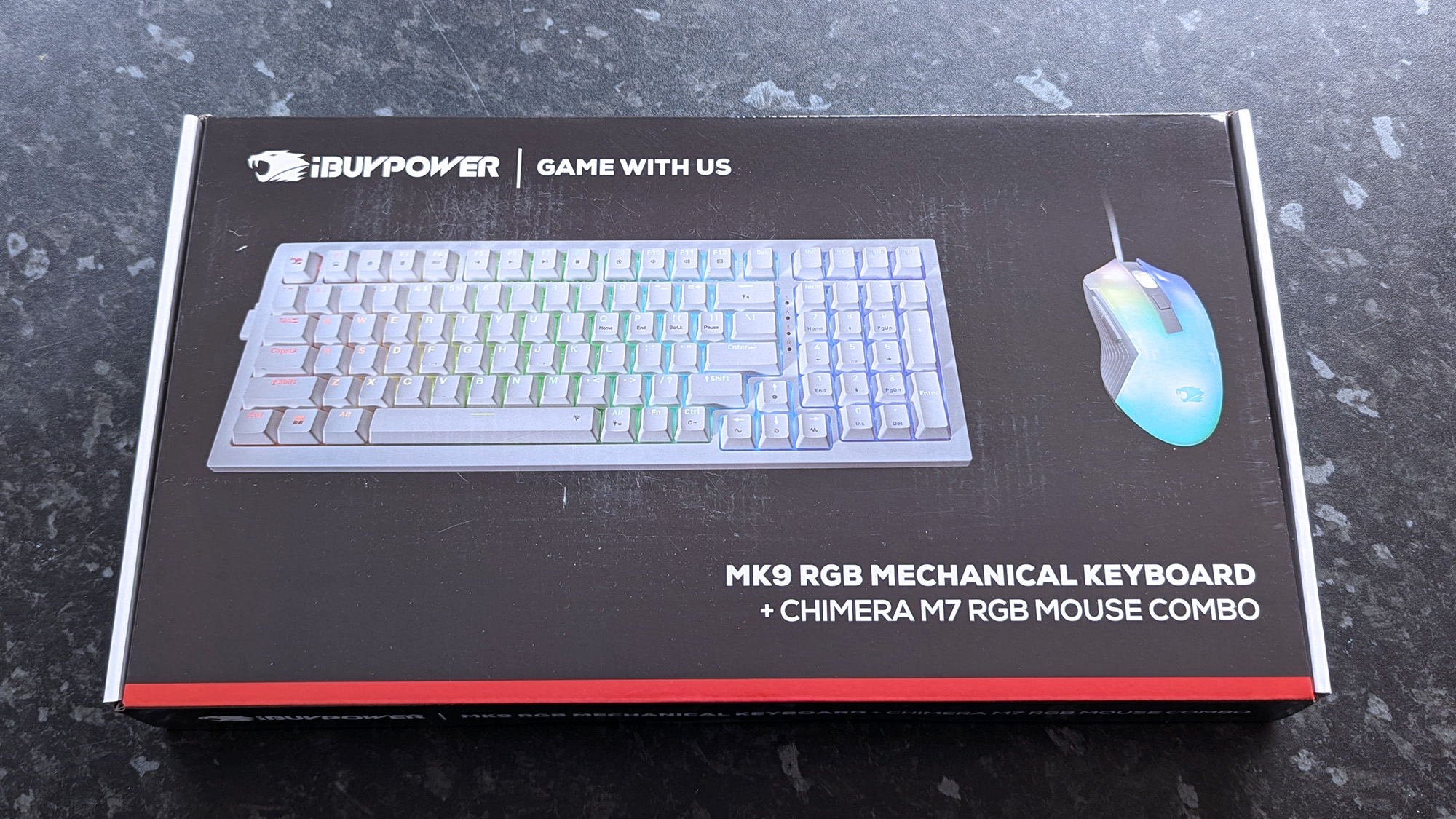 White iBUYPOWER keyboard and mouse in retail box