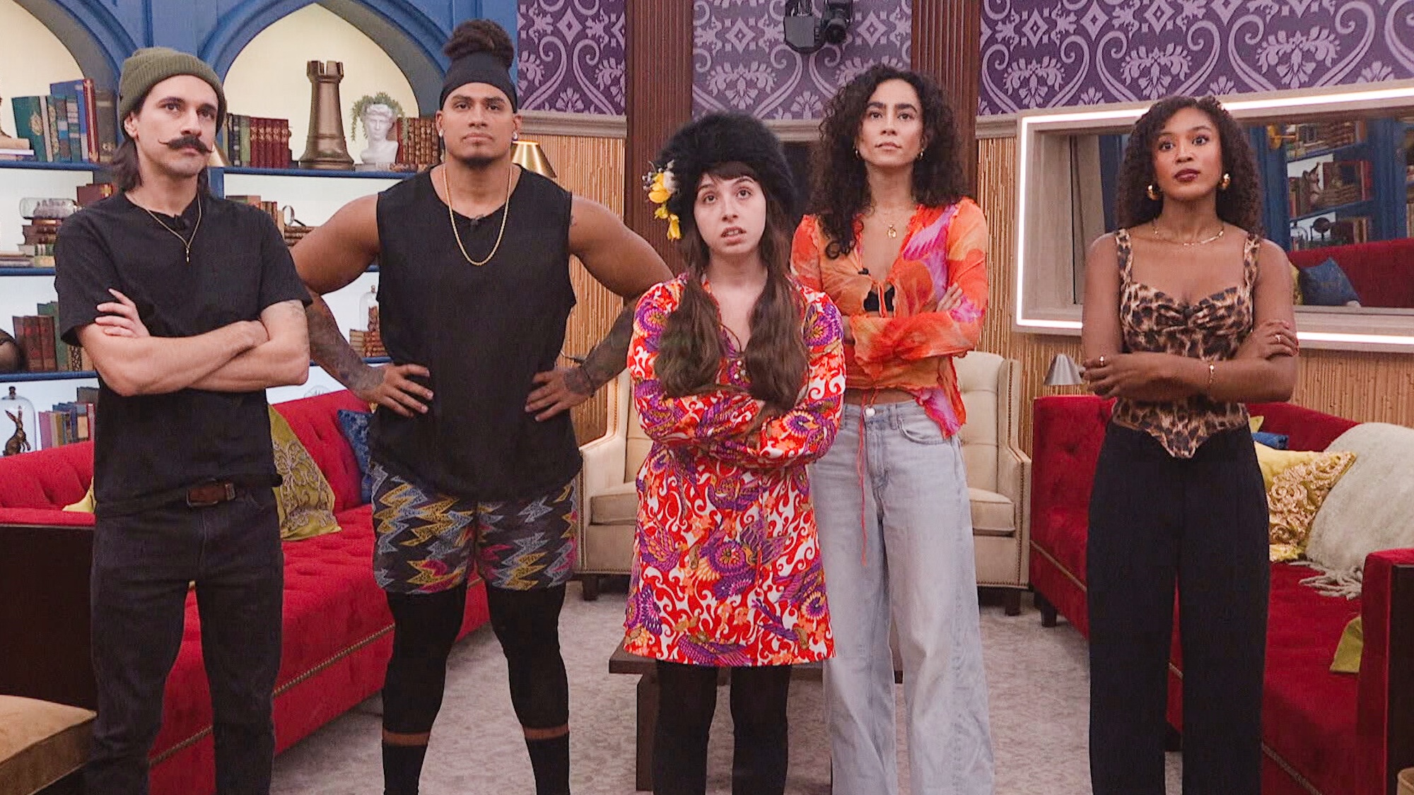 Big Brother Season 27 houseguests standing together and frowning at something in Big Brother Season 27