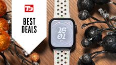 Apple Watch Series 9 on desk with deals overlay