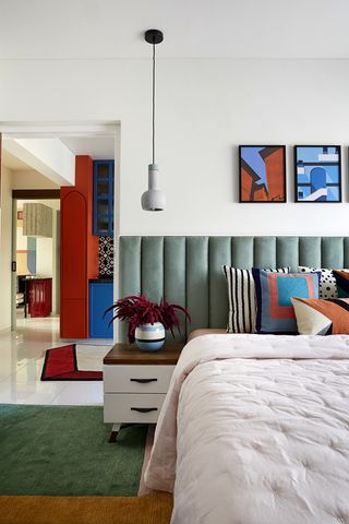 A colorful bedroom with an equally vibrant rug