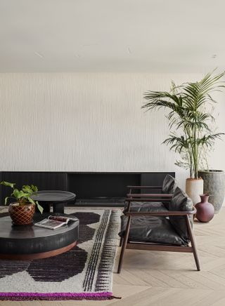 Bloc722's Kifissia House, living room detail with fireplace and chair