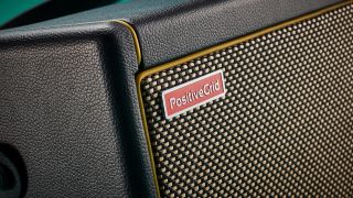 Close up of the logo, piping, and tolex on a Positive Grid Spark 40 amp