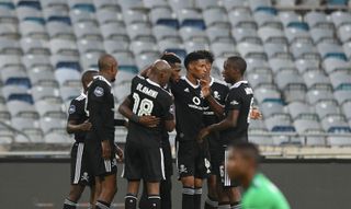 Fortune Makaringe of Orlando Pirates celebrates goal with teammates