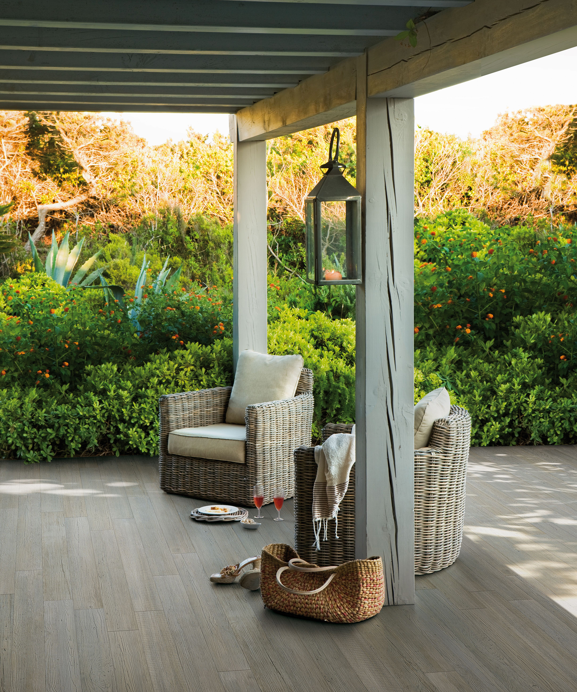 pergola covering a decked area in a backyard