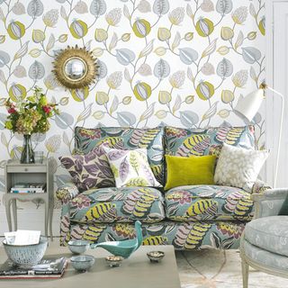living room with leafy woodland pattern prints