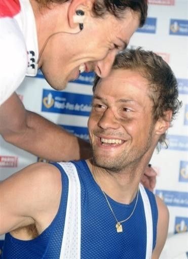 Boonen is congratulated by runner up Fabian Cancellara.