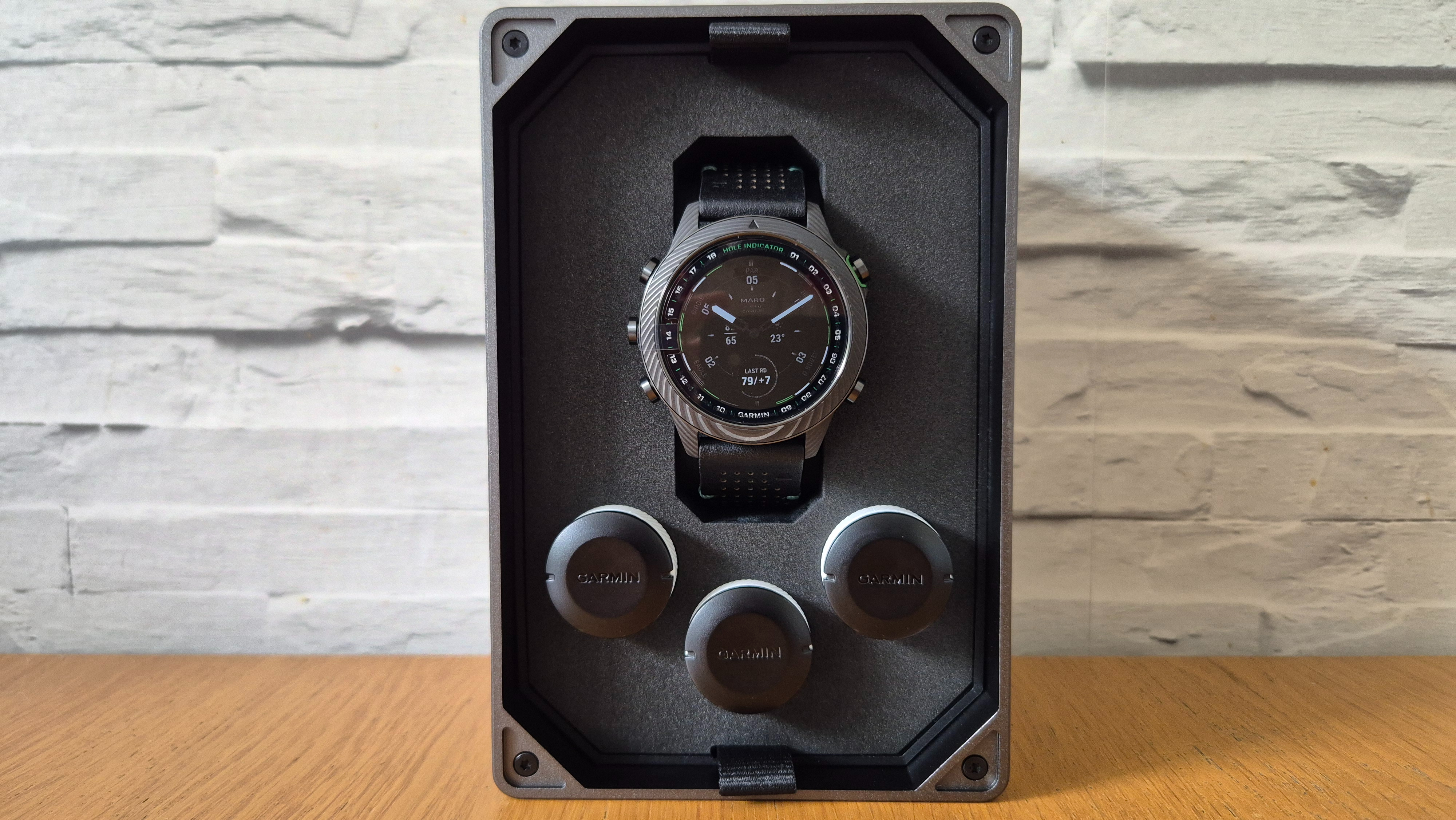 The Garmin MARQ Golfer (Gen 2) on a wooden surface