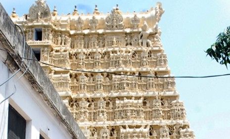 Police officials secure the area around the Hindu temple in Kerala, India