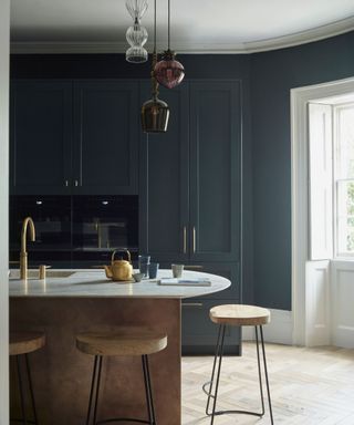 Blue kitchen cabinets, copper bottom kitchen island