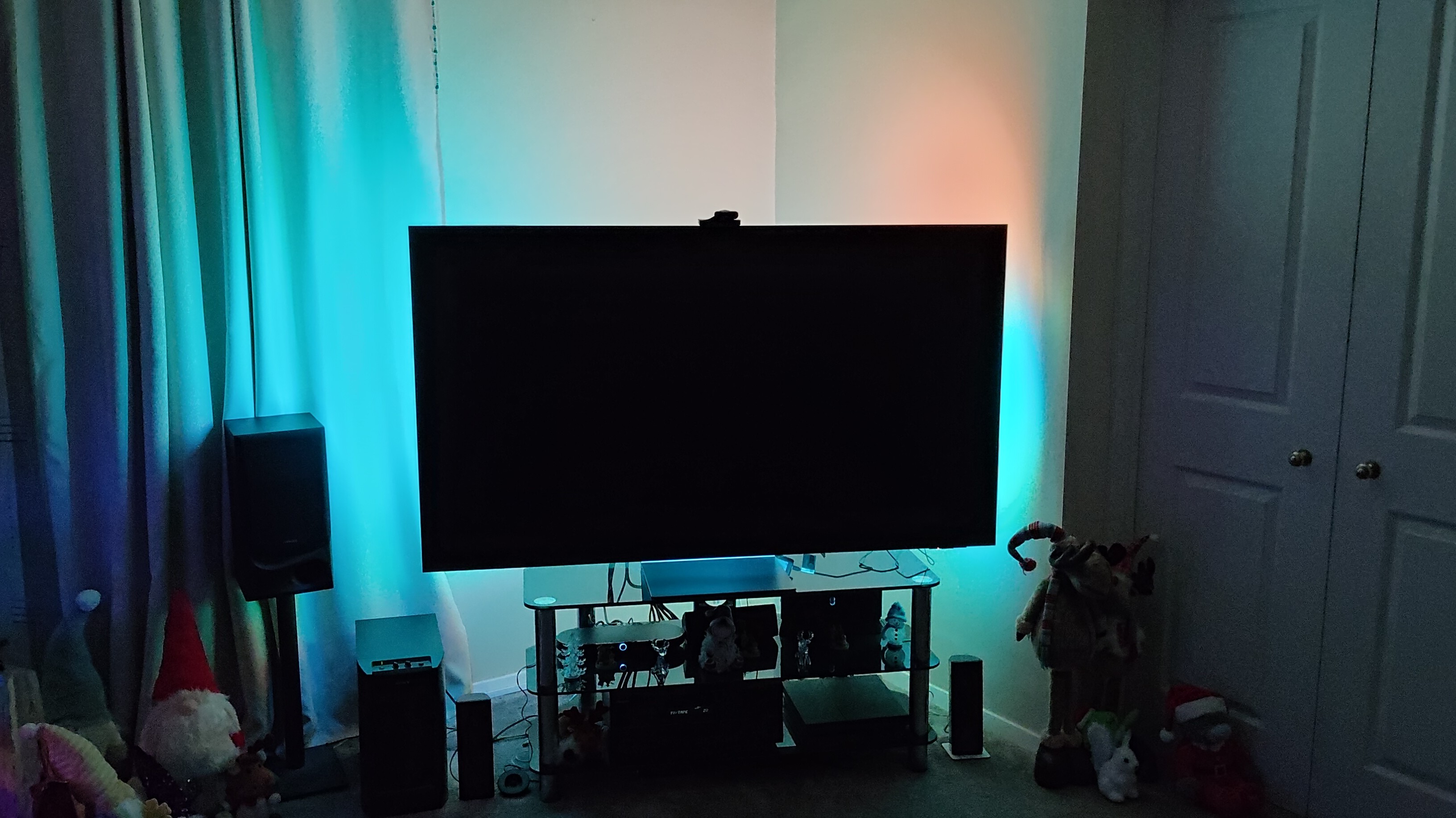 A TV illuminated by a blue light from the Govee TV Backlight 3 Pro