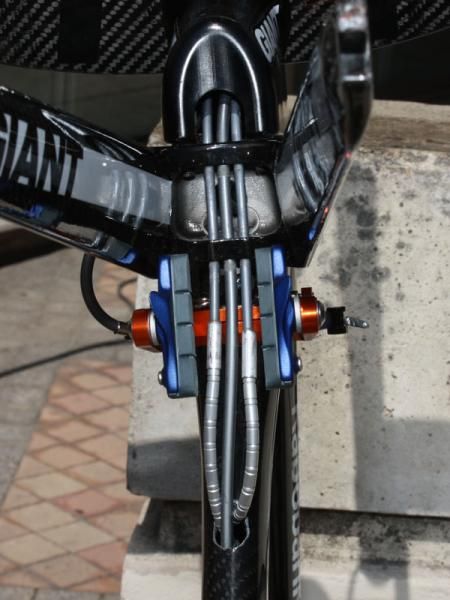 The aluminum fork crown directs the cables straight back towards the down tube. Giant says extra flexible sections of housing such as Nokon are necessary in this area for optimum function and full production bikes will feature an aluminum ring to protect the edges of the down tube access hole.