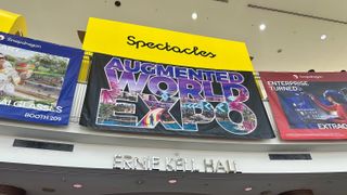 A photo of the Augmented World Expo sign at the entrance of Ernie Kell Hall convention center in Long Beach.