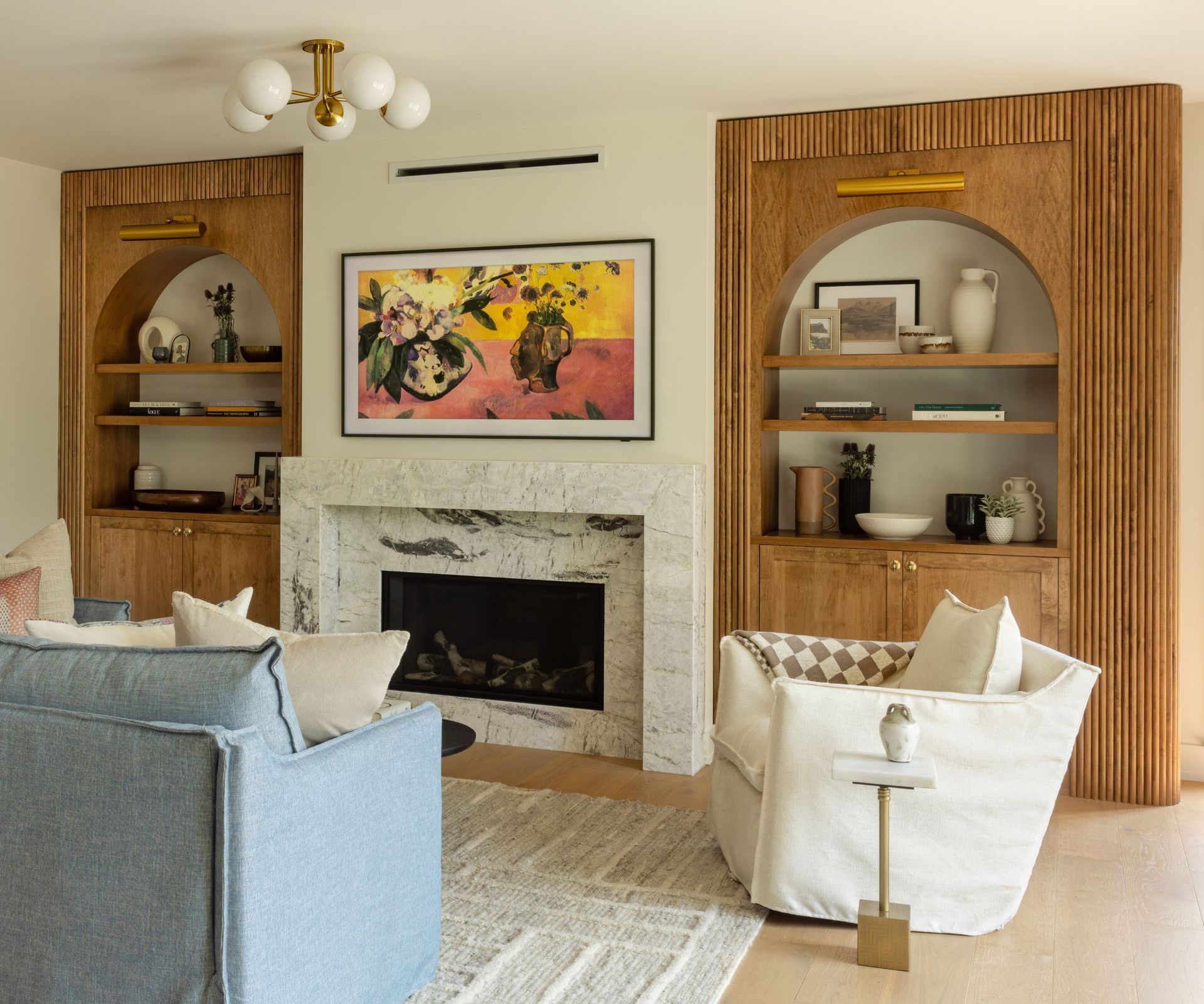 living room with arched wooden alcove shelving