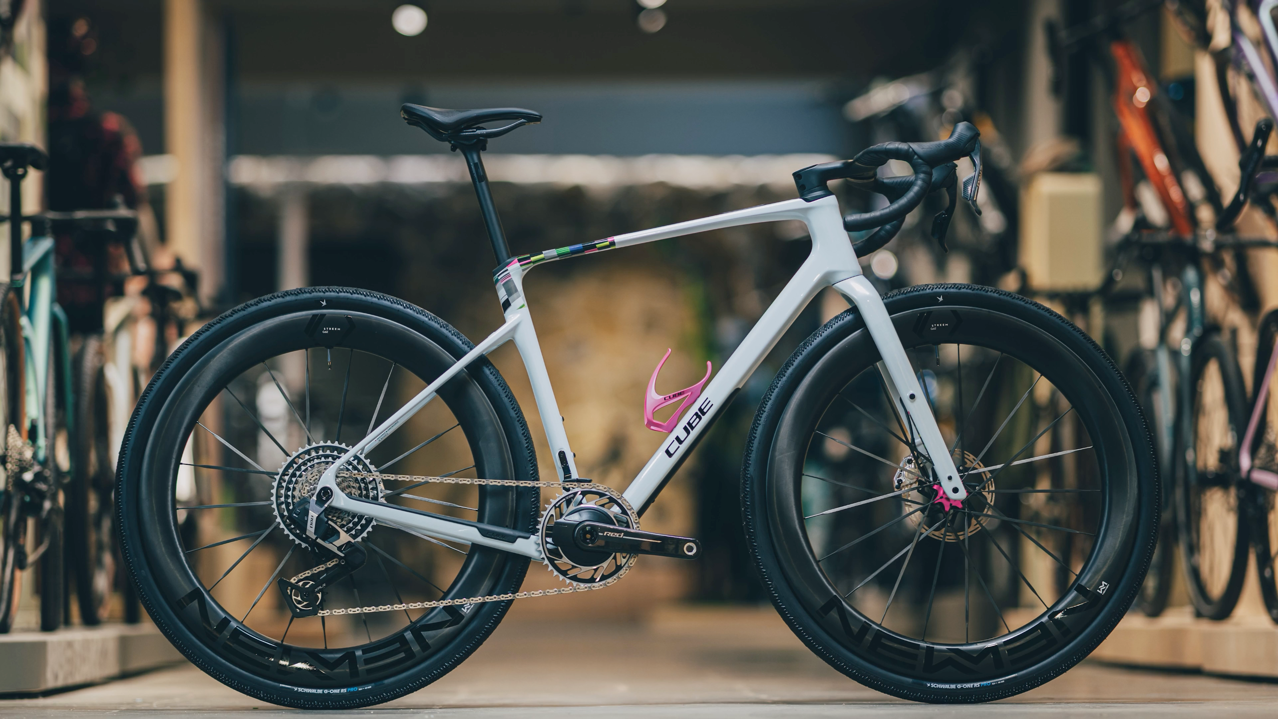 A blue, white and red road bike in an urban environment