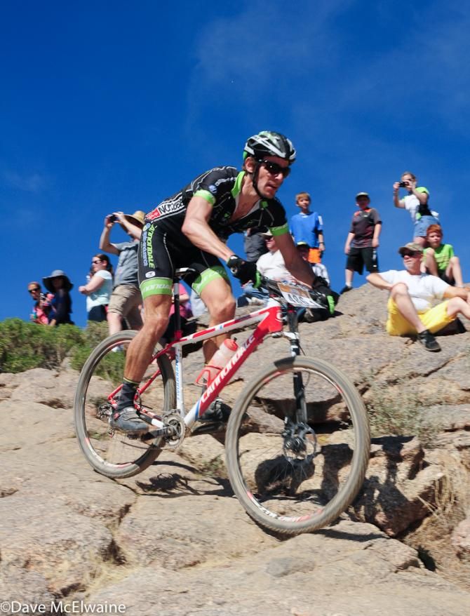 A Cannondale Epic Endurance racer finishing lap one in first place