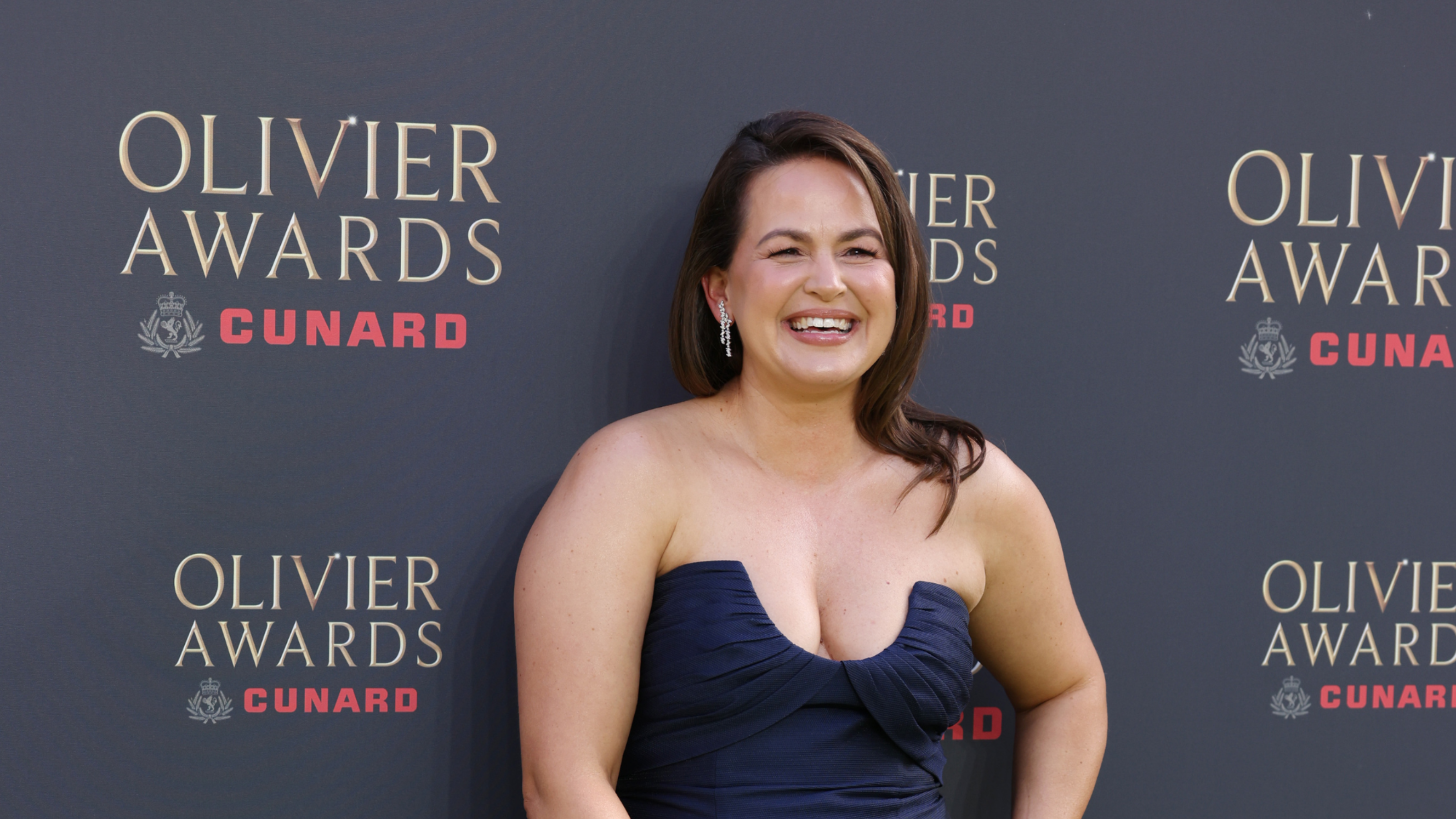 Giovanna Fletcher in navy ballgown on Olivier Awards 2026 red carpet.
