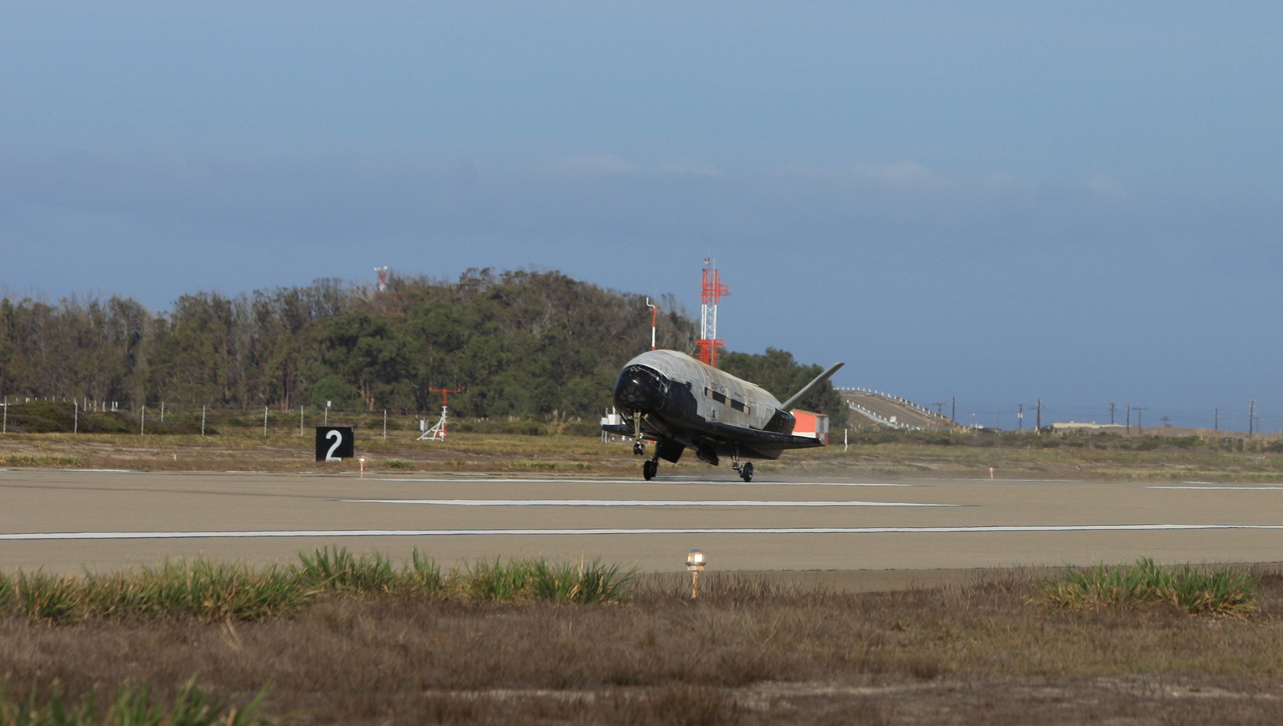 A U.S. Air Force X-37B space plane swoops down for a landing at Vandenberg Air Force Base in California on Oct. 17, 2014 after spending 22 months in space on a secret mission.