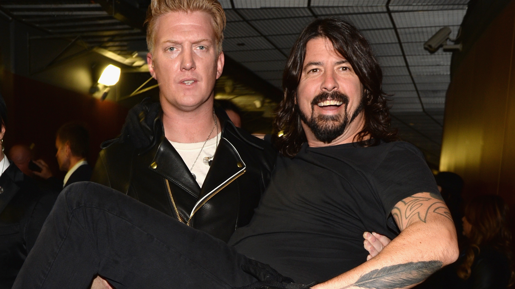 Josh Homme (L) of Queens of the Stone Age and Dave Grohl of Foo Fighters attends the 56th GRAMMY Awards at Staples Center on January 26, 2014