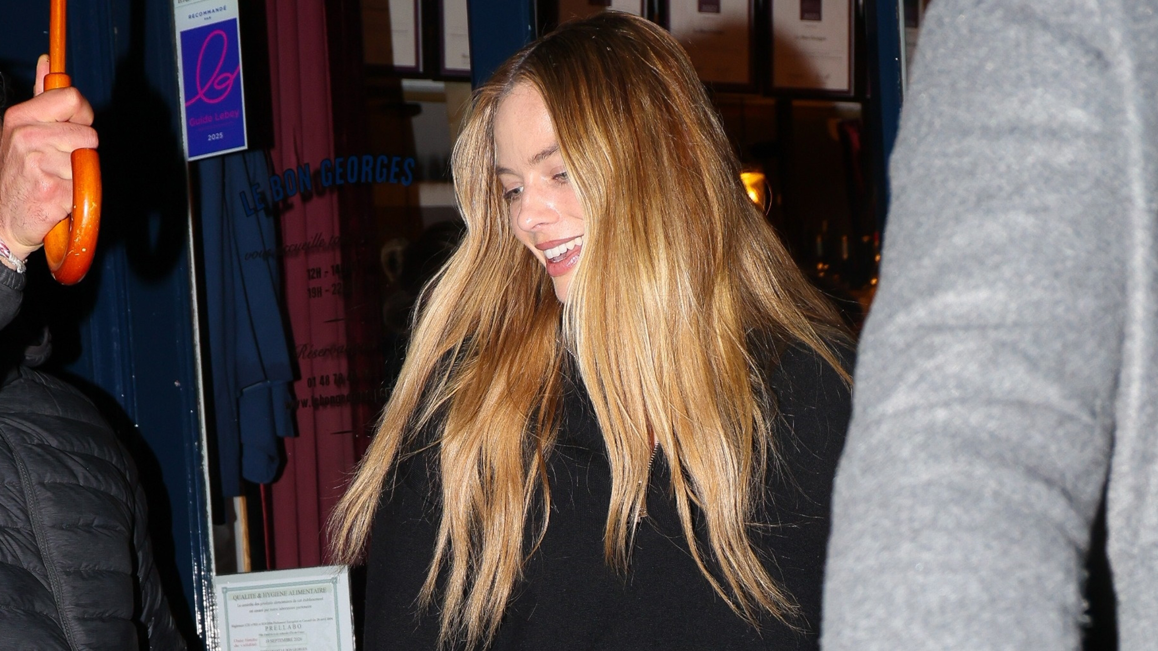 Margot Robbie was seen enjoying a day out with friends while spending time in Paris. She wore Chanel jeans and carried a Hermes bag as the group strolled through the city together.