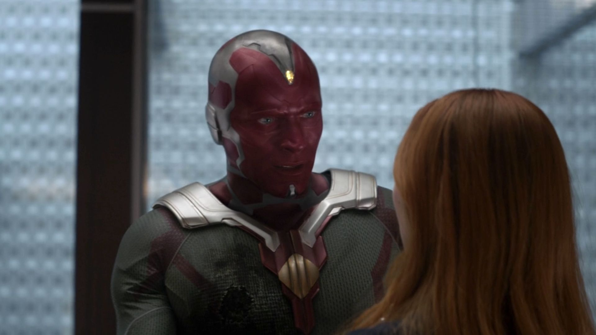 Vision with a wound talking to Wanda at the Avengers Compound in Infinity War.