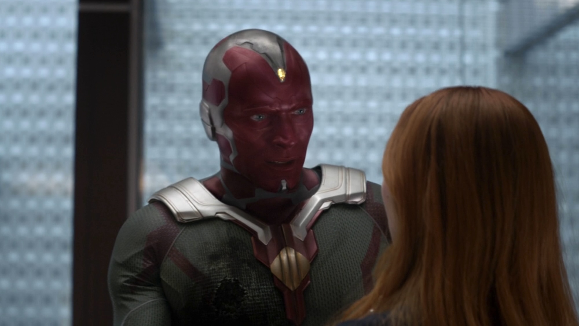 Vision with a wound talking to Wanda at the Avengers Compound in Infinity War.