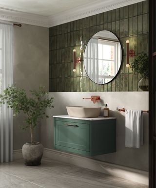 A green and white small bathroom with a floating vanity