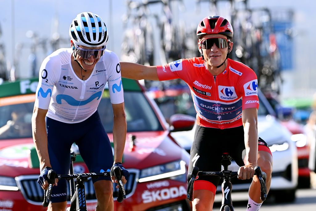 MADRID SPAIN SEPTEMBER 11 LR Enric Mas Nicolau of Spain and Movistar Team and Remco Evenepoel of Belgium and Team QuickStep Alpha Vinyl Red Leader Jersey competes during the 77th Tour of Spain 2022 Stage 21 a 967km stage from Las Rozas to Madrid LaVuelta22 WorldTour on September 11 2022 in Madrid Spain Photo by Tim de WaeleGetty Images