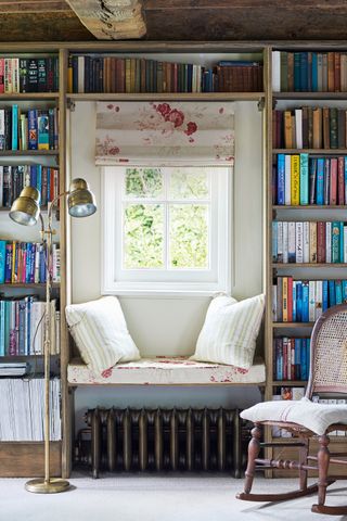 Books surrounding a window seat
