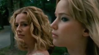 Elisabeth Shue and Jennifer Lawrence stand together with solemn looks in The House at the End of the Street.
