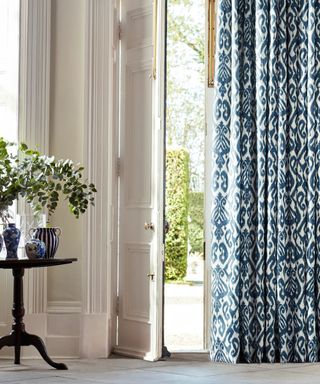 Sanderson Ikat Damask Ink Blue curtain at front door by Blinds2Go